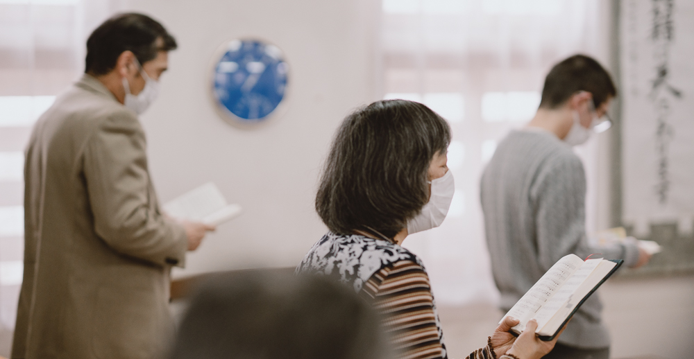 Church members singing hymns during Sunday service.
