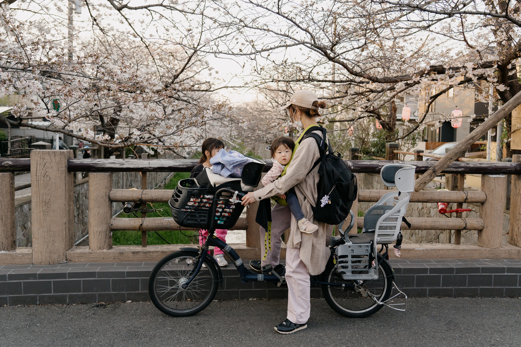 <span style="color: rgb(0, 0, 0);">A mom out with her children in a local suburb.</span>