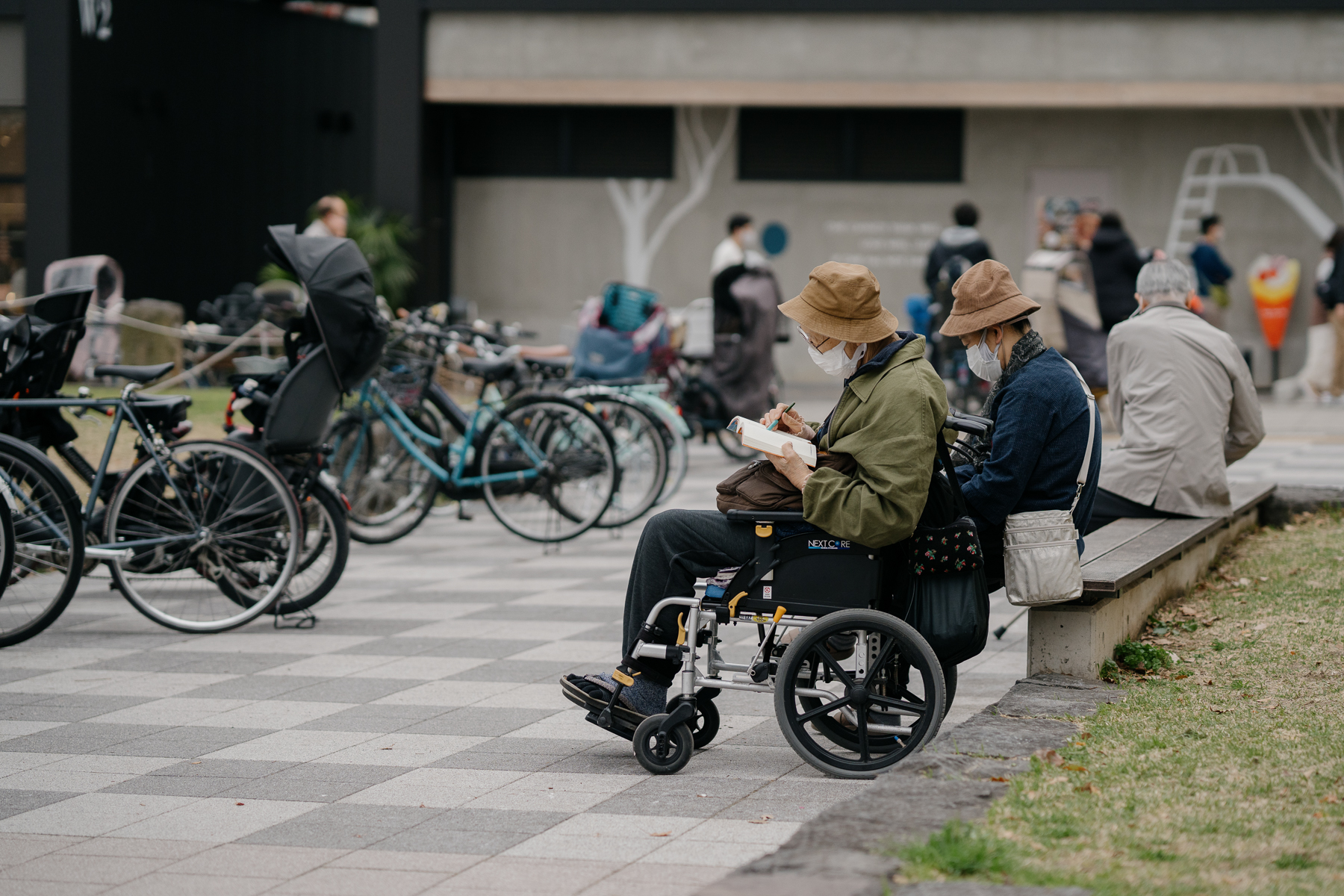 <span style="color: rgb(0, 0, 0);">A man reading at a neighborhood park.</span>
